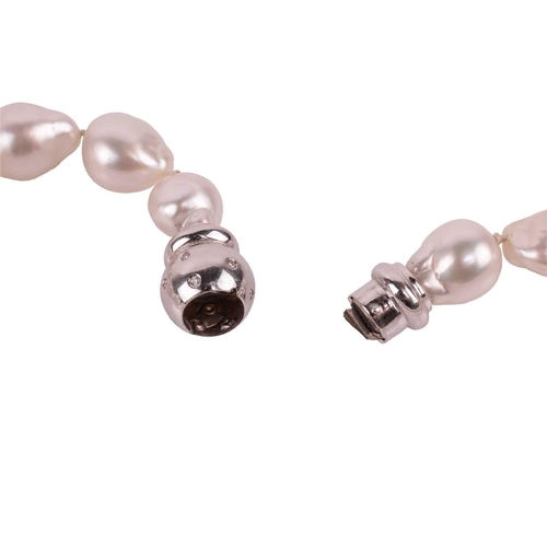 99 - A cultured baroque pearl necklace with diamond-set clasp, comprising a single row of graduated baroq... 