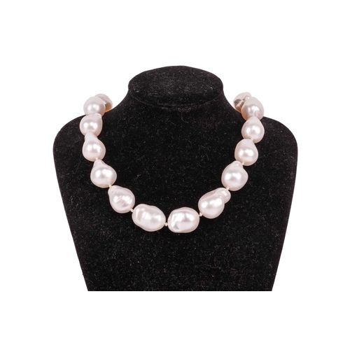 99 - A cultured baroque pearl necklace with diamond-set clasp, comprising a single row of graduated baroq... 