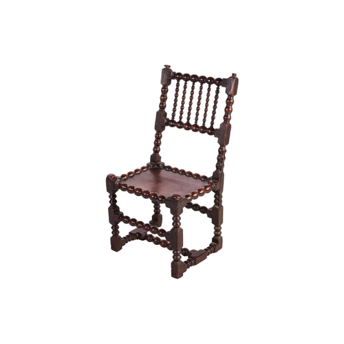 108 - A William III bobbin-turned oak back stool with a floating panel seat, the underframe of conforming ... 