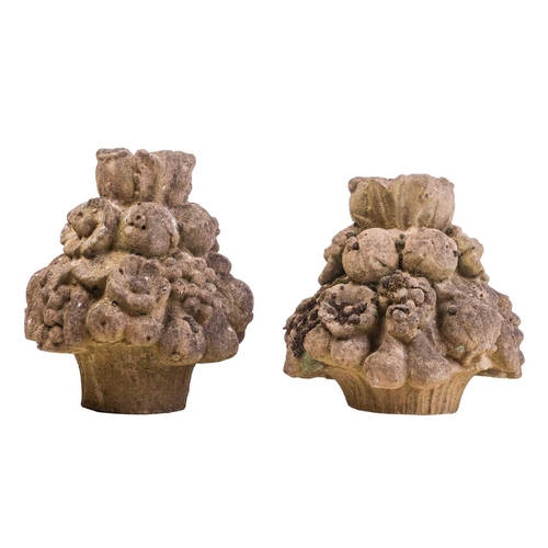 110 - A pair of reconstituted stone decorative bouqet finials, 35 cm high.