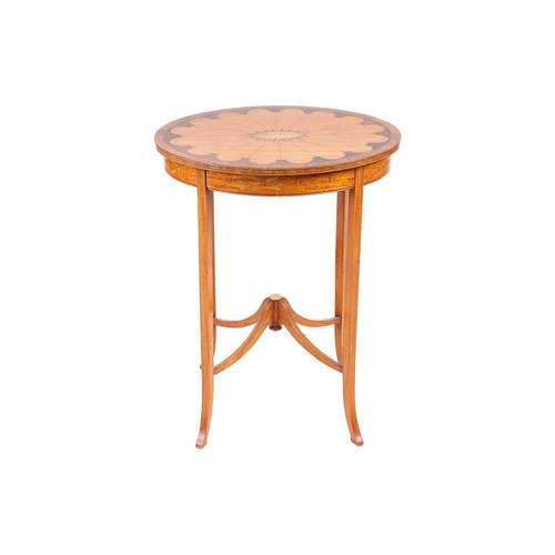 122 - In the manner of Druce & Co of London, an Edwardian inlaid figured satinwood oval centre table the t... 