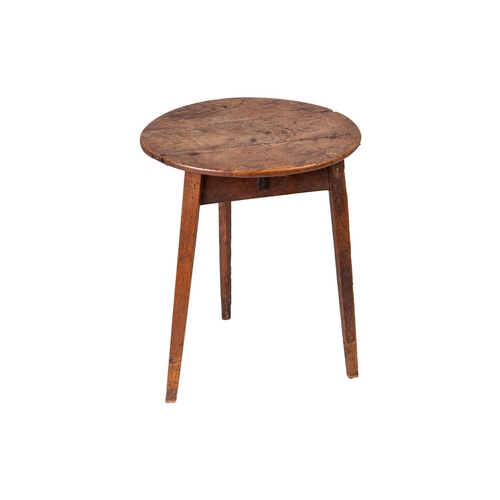 133 - An early 19th-century rustic elm cricket table with a planked top of good mellow colour, the base wi... 