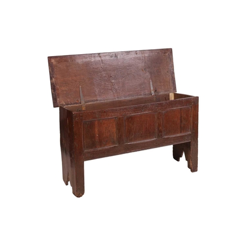 100 - An early 18th-century three-panel oak coffer with solid plank top, supported by end stile supports. ... 