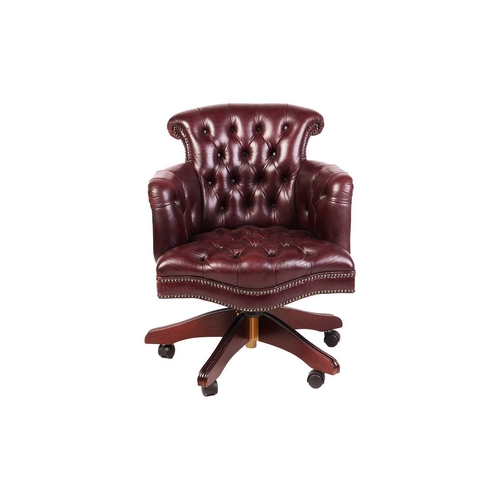 101 - A George Smith of London deep buttoned hide Captain's Swivel Chair, with close nailed dark tan uphol... 