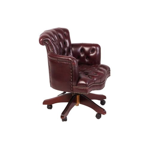 101 - A George Smith of London deep buttoned hide Captain's Swivel Chair, with close nailed dark tan uphol... 