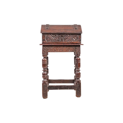 105 - A Charles I oak joint stool with a single piece top the frieze carved with lunettes and with turned ... 