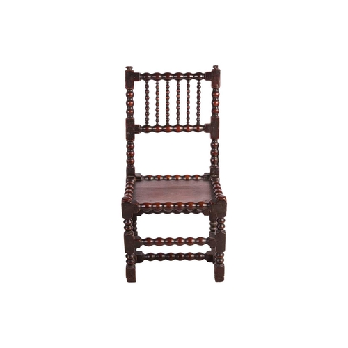 108 - A William III bobbin-turned oak back stool with a floating panel seat, the underframe of conforming ... 