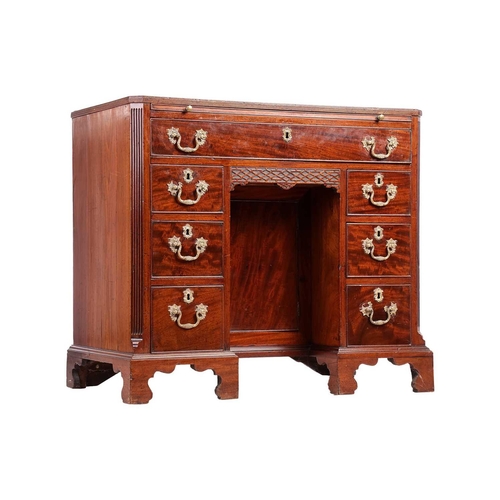 130 - George III Chippendale period mahogany kneehole writing desk with brushing slide and canted corners ... 