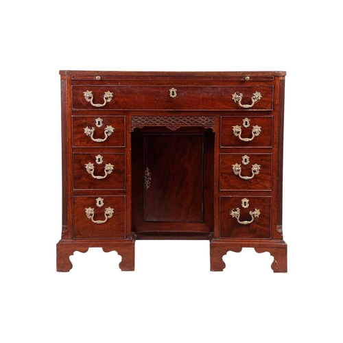 130 - George III Chippendale period mahogany kneehole writing desk with brushing slide and canted corners ... 