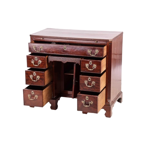 130 - George III Chippendale period mahogany kneehole writing desk with brushing slide and canted corners ... 