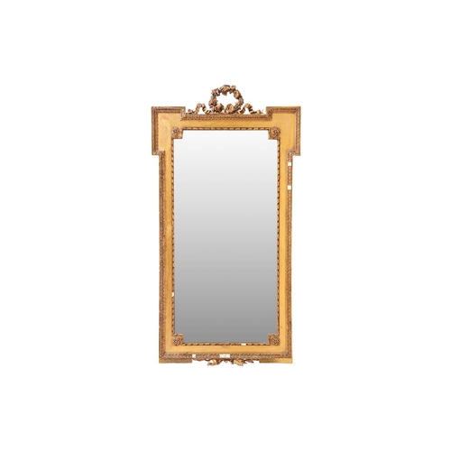 140 - An Edwardian carved wood and gilt gesso pier glass with an inverted breakfront outline with rose gar... 