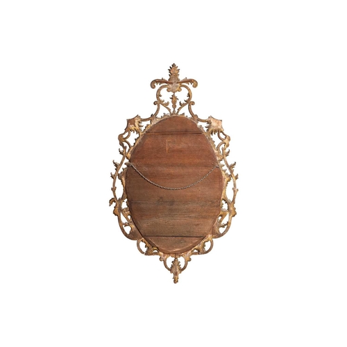 141 - A 19th-century oval carved wood and gilt gesso wall mirror with pierced rococo a feather plume mantl... 