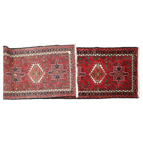 147 - A red ground Karaja strip runner with nice lozenges on a central pole, within multiple borders, 295c... 