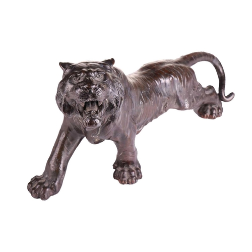 162 - After Seiya, a Japanese bronze patinated spelter figure of a stalking tiger, early 20th century, unm... 