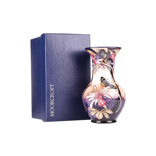 175 - A collection of boxed contemporary Moorcroft items, comprising: a 'Longwing' pattern vase, designed ... 