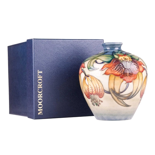 175 - A collection of boxed contemporary Moorcroft items, comprising: a 'Longwing' pattern vase, designed ... 