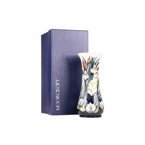 175 - A collection of boxed contemporary Moorcroft items, comprising: a 'Longwing' pattern vase, designed ... 