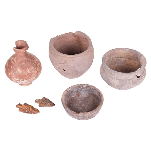 180 - A small old collection of Roman pottery vessels (af) and remaining shards and knapped flint arrowhea... 