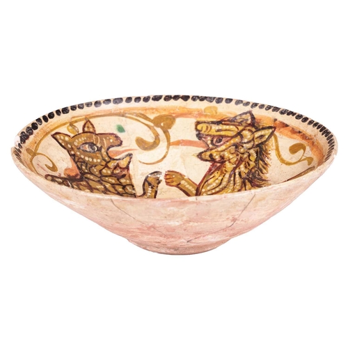 55 - A Persian Nishapur circular pottery bowl, 10th century, painted in earth pigments of a slip-covered ... 