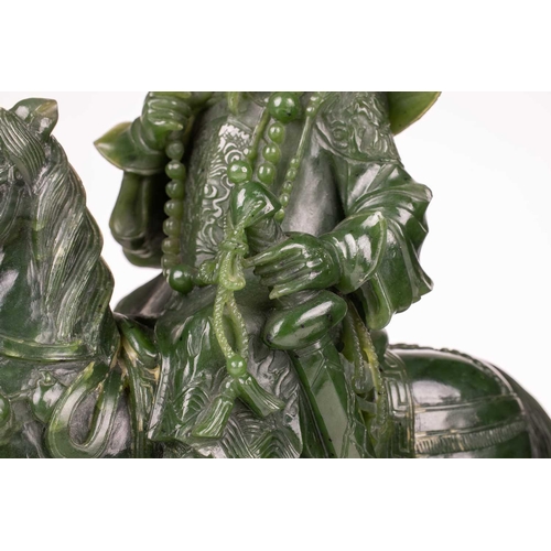 58 - A pair of large and impressive Chinese spinach green jade equestrian carvings, 20th century, one mou... 