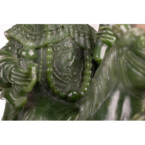 58 - A pair of large and impressive Chinese spinach green jade equestrian carvings, 20th century, one mou... 