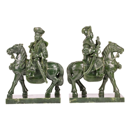 58 - A pair of large and impressive Chinese spinach green jade equestrian carvings, 20th century, one mou... 