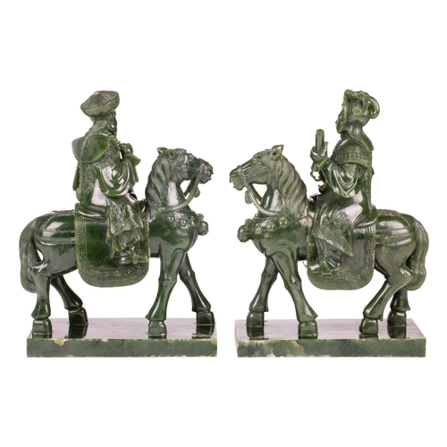 58 - A pair of large and impressive Chinese spinach green jade equestrian carvings, 20th century, one mou... 