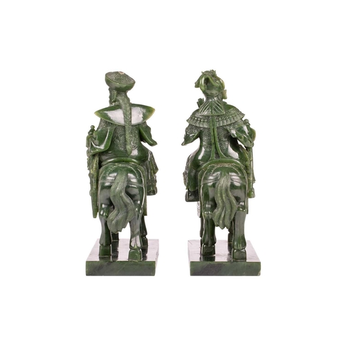 58 - A pair of large and impressive Chinese spinach green jade equestrian carvings, 20th century, one mou... 