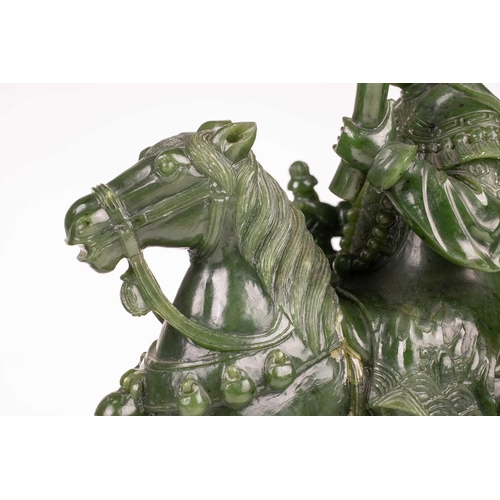 58 - A pair of large and impressive Chinese spinach green jade equestrian carvings, 20th century, one mou... 