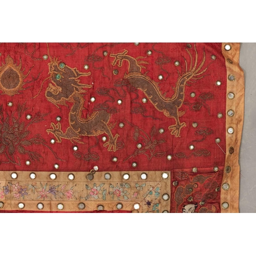 61 - A large Chinese 19th/20th-century red silk embroidered imperial portrait of the Emporer bordered wit... 