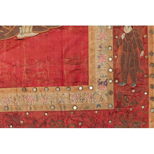 61 - A large Chinese 19th/20th-century red silk embroidered imperial portrait of the Emporer bordered wit... 