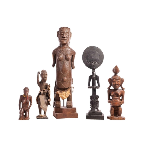 66 - Six various African Tribal carvings including a Luba Witch Doctor figure, 47 cm high, and two Ivory ... 