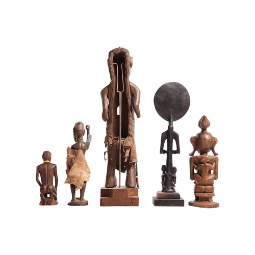 66 - Six various African Tribal carvings including a Luba Witch Doctor figure, 47 cm high, and two Ivory ... 