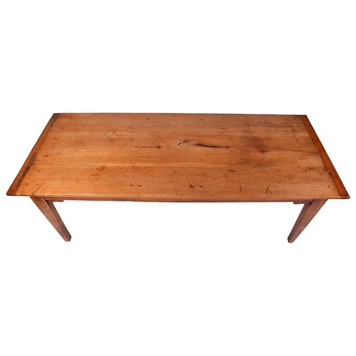 74 - A French 19th-century cherrywood farmhouse table with a narrow planked and clamped top of mellow col... 