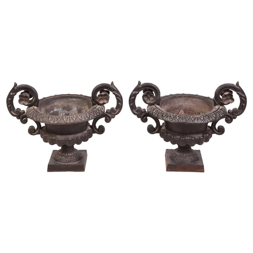 76 - A pair of decorative heavy cast-handled table urns of Campagna form, with a pair of scroll handles a... 