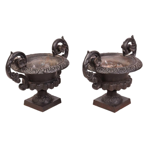 76 - A pair of decorative heavy cast-handled table urns of Campagna form, with a pair of scroll handles a... 