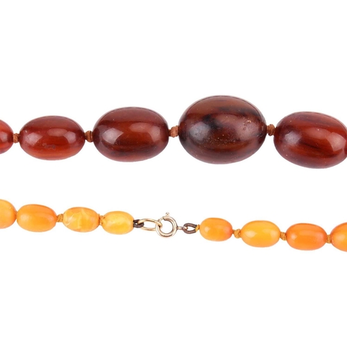 10 - Two beaded necklaces; to include a single-strand amber bead necklace with graduated butterscotch amb... 