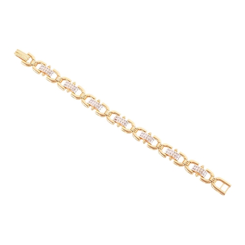 21 - A diamond-set link bracelet, of reeded design, composed of eight rounded links with seven domed link... 