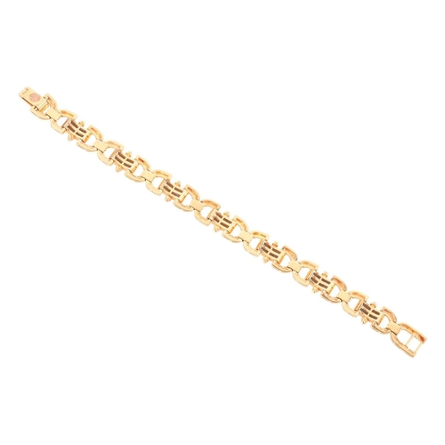 21 - A diamond-set link bracelet, of reeded design, composed of eight rounded links with seven domed link... 