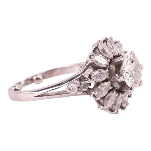 34 - A diamond daisy cluster ring, with an estimated total diamond weight of 2.15ct, centred with an old-... 