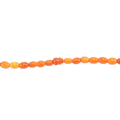 35 - Two amber bead necklaces; a row of butterscotch graduated oval amber beads from 15.0 mm in length to... 