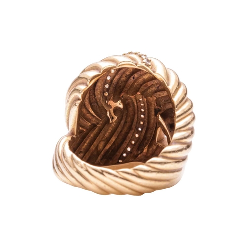 42 - A diamond-set knot ring, of ribbed design, highlighted with a row of diamond embellishment estimated... 