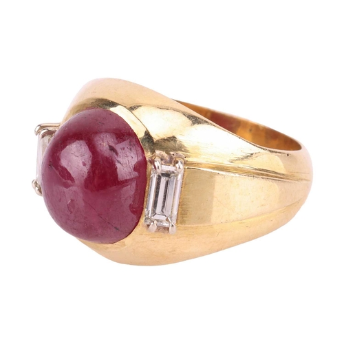 44 - A ruby and diamond dress ring, gypsy mount centred with an oval ruby cabochon of 10.5 x 8.9 x 5.8 mm... 