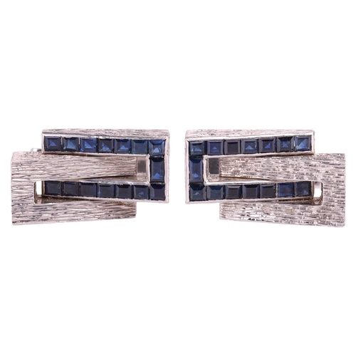 45 - Kutchinsky - a pair of cufflinks set with sapphires; of geometric design with bark effect finish, ch... 