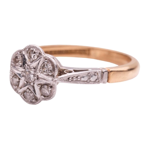 54 - A diamond ring of floral design, estimated total diamond carat weight 0.07ct, set in yellow and whit... 