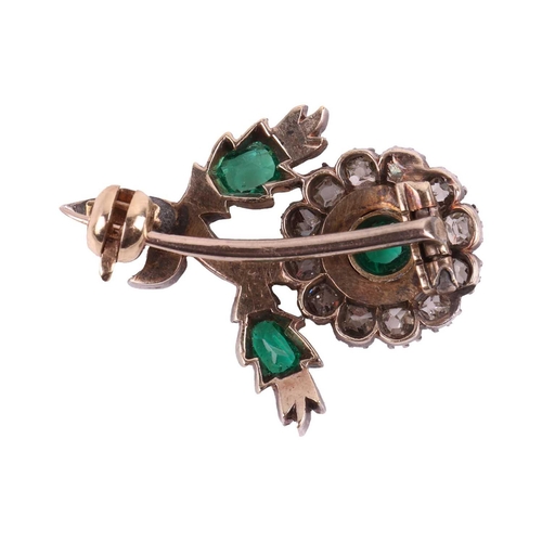 56 - A Victorian emerald and diamond-set brooch, depicting a flower, featuring three emeralds accented by... 