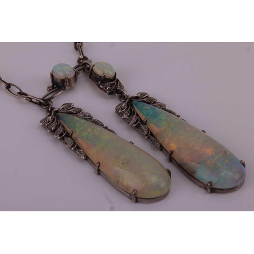 62 - An opal-set négligée necklace, suspending two large teardrop opal cabochons of 4.0 x 1.8 cm, claw-se... 