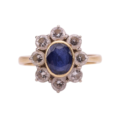 70 - A sapphire and diamond cluster ring, estimated total diamond carat weight 0.96ct, the central collet... 