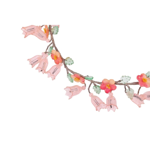 8 - A Continental early 20th-century floral fringe necklace, suspending a series of plastic tulips and h... 