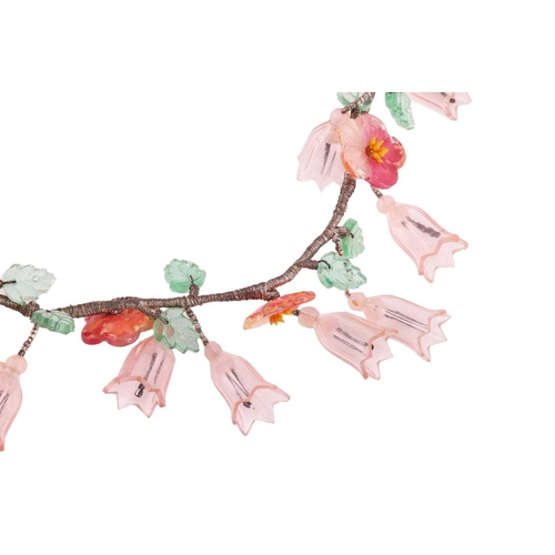 8 - A Continental early 20th-century floral fringe necklace, suspending a series of plastic tulips and h... 